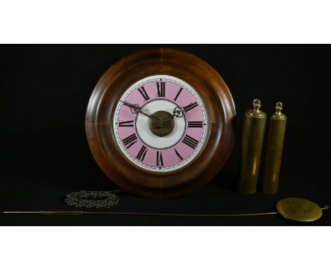 A 19th century postman's alarm clock, 17.5cm pink and white enamel dial inscribed with Roman numerals, centred by a brass set