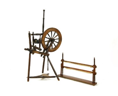 A 19th century turned wooden spinning wheel stamped A.S. Andison, Hillswich, 113cm high, together with a tapestry stand (2)