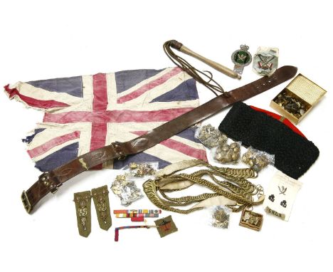 A collection of military buttons, Gurkha shoulder patches, five Royal Gurkha rifles, frontier force badges, a car badge, a ra