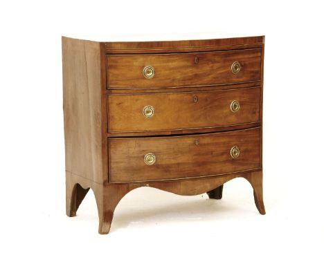 A George III bow front chest of three drawers, each on out swept bracket feet, the drawers with brass ring handles, and all 8