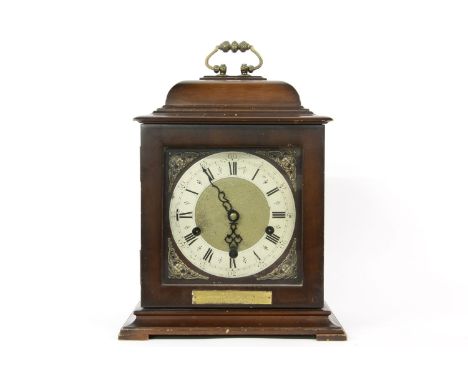 Three train mantel clock, striking the quarters in gongs, with presentation inscription, 33cm high