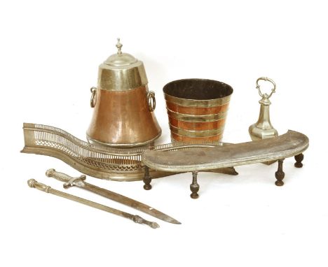 Fireside tools: a serpentine pieced fender, two copper and brass pails, one with a lid, a doorstop, a French short sword, of 