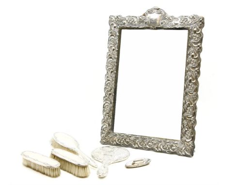 A large Art Nouveau silver mounted dressing table mirror, stylized foliate frame around rectangular bevelled plate, marks for