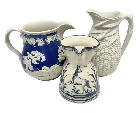 Victorian feldspathic stoneware jug with hunting scene, together with a Victorian Majolica corn jug and another jug 