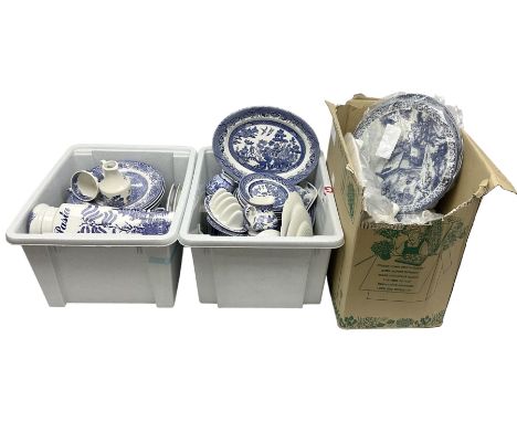 Collection of blue and white tea and dinner wares mainly in willow to include plates, cups and saucers, teapots etc, in three