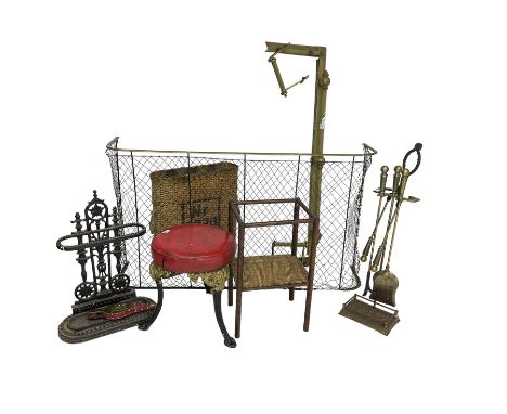 19th century brass and wrought metal fender or spark guard, wicker basket, brass fender, cast iron black finish umbrella and 