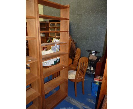 A light Oak set of floor standing Bookshelves two fixed and four adjustable, 24" wide, 80" high and 7" deep.