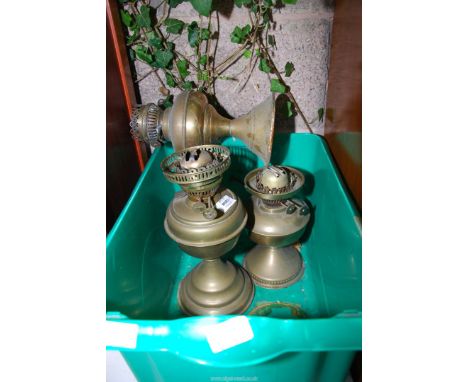 Three brass oil lamp bases.