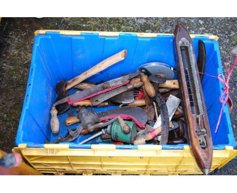 Box of tools: oil can, draw plane, meat cleaves, small hatchet, grass hooks, meat mincer, etc.