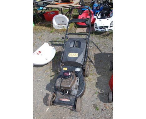 A 'Lawn King' propelled mower with Briggs &amp; Stratton engine - engine turns.