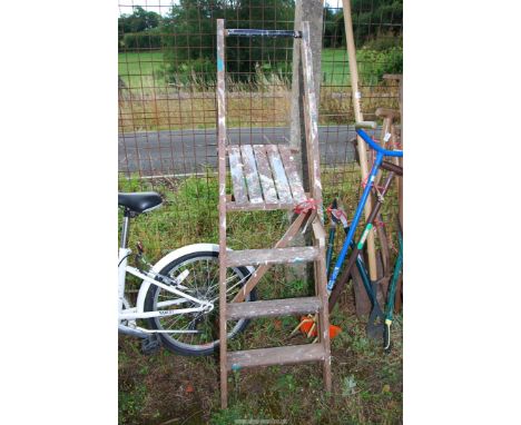 Four rung wooden step ladder.