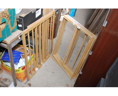 A pine clothes horse and a child's stair gate.