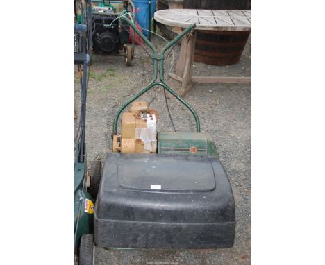 A cylinder mower 18" cut with a Briggs &amp; Stratton 2HP engine - turns ok.