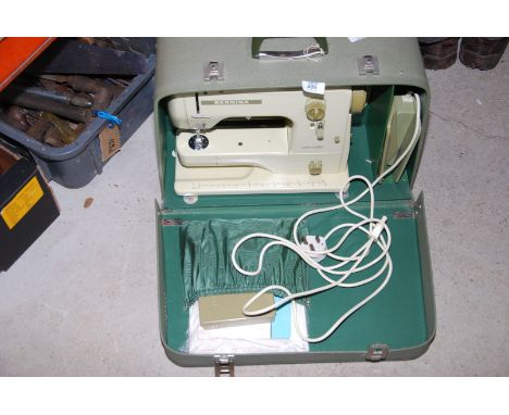 A cased 'Bernina Minimatic 707' sewing machine model no. 68095071