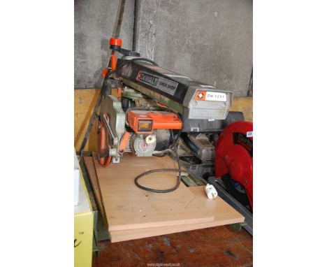 A De Wallt slid action Saw, model DW1251 (working but new plug top required).
