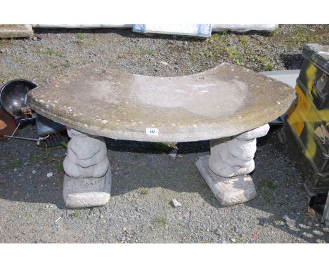 A concrete garden bench with squirrel pillars, 39'' wide x 17 1/2'' high.