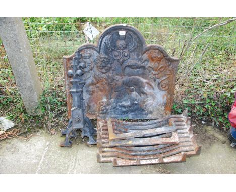 A cast iron Fireback depicting lion with thistle, fleur-de-lys and rose emblems, 29 3/4'' wide x 27'' high plus Fire Dogs and