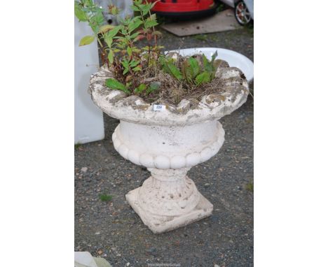 A large urn shaped planter, 23" high x 23" diameter.