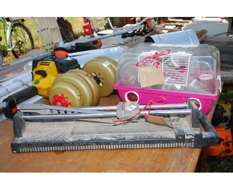 Mouse/hamster cage and a tile cutter.