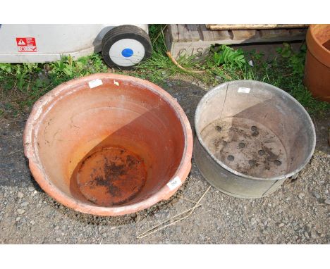 A dairy bowl, 17 1/2" x 10" and a galvanised planter.