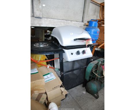 A Laguna two burner Gas Barbecue with side burner, plus tools.