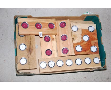 A box of wooden tea light holders.