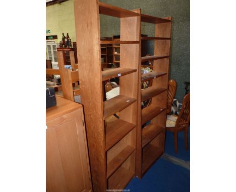 A light Oak set of floor stsading Bookshelves, two fixed and three adjustable, 24'' wide x 80'' high x 7'' deep.