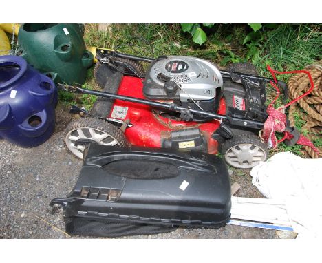 An eFco LR 65 lawn mower with a Briggs &amp; Stratton engine plus grass box - turns ok.