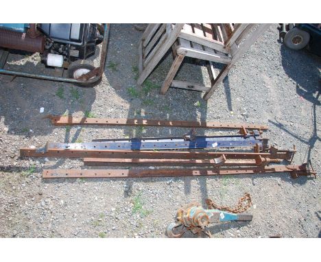 A quantity of long sash clamps with extensions.