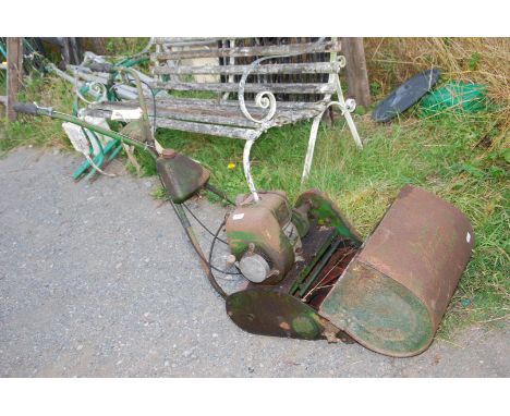 A Qualcast 4 stroke commodore cylinder mower - engine turns.