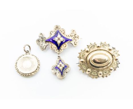 A collection of 19th Century mourning jewellery to include a Victorian brooch with half pearl and ruby flower motif overlaid 