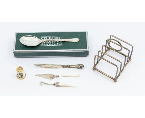 A collection of silver items to include a miniature toast rack, size approx  57 x 46 x h 70mm, marked by T Wilkinson & Sons, 