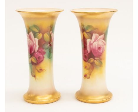 A pair of Royal Worcester hand painted Roses vases, signed M. Hunt, gilt detail, marked 15.54 to base near transfer printed m