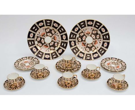 A collection of Royal Crown Derby, 2451, six coffee cans, saucers and plates with two large plates.