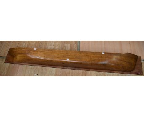 A large wall-mounted boat hull with ship building markings to scale, from a boatyard in Cornwall. 208cm long. Provenance: Bar