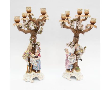 A pair of late 19th century Sitzendorf figural six light candelabra, the entire modelled as trees, the detachable branches wi