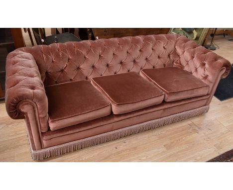 A mid 20th century three-seater button-back Chesterfield-style sofa