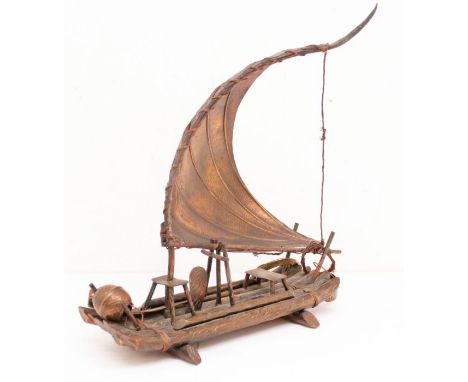 A bronzed Chinese model of a fishing boat, present to Ray Griffin General Motors for help in Brazilian Car Company 1962, insc