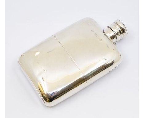 A Victorian silver spirit flask with plain design and detachable cup and hinged top, gilt interior to cup inside, hallmarked 