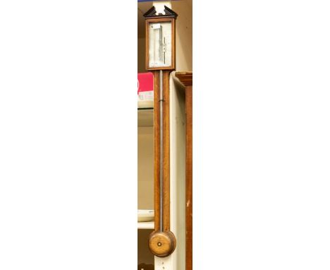 A P. Comolli and Co of Dudley oak stick barometer with hinged glass door to top and inlaid decoration.Approx. 94cm long.Furth