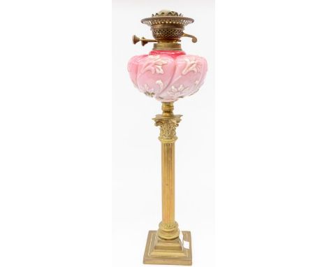 A Victorian opaque glass and brass oil lamp with original shade. Flume missing.