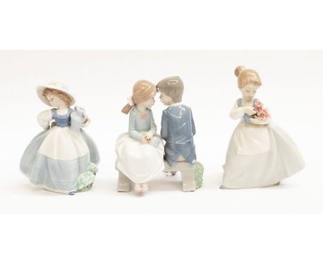 Three Nao figurines of young children