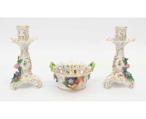 A pair of Dresden porcelain candlesticks, together with a matching petal dish with flower detail