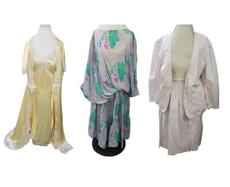 A 1980s floral grey background and pink/blue/green full skirt and exaggerated blouson, size 10 matching top on raglan sleeves