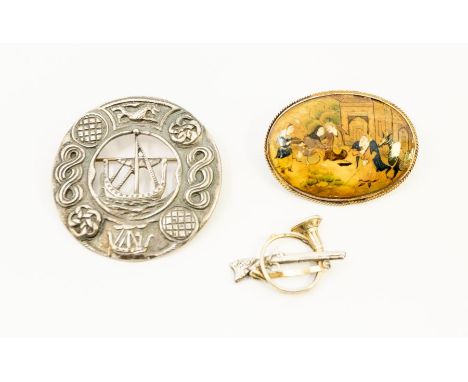 *****AUCTIONEER TO ANNOUNCE THE BUGLE IS A PLACE CARD HOLDER USED AT SHOOTS***A silver Celtic brooch depicting a boat to the 
