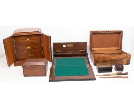 A late 19th century desk top cabinet with three drawers, inlaid details to the wood, together with a tea caddy, 2 writing slo