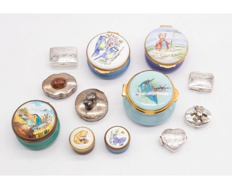 A small collection of pill boxes to include silver hallmarked examples, Crummles, and Halcyon Days
