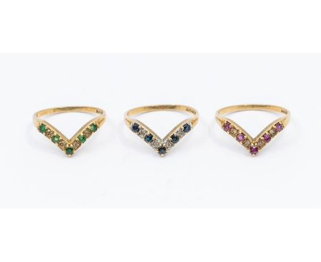 A collection of three 9ct gold coloured gem diamond set wishbone rings including a ruby, sapphire and emerald versions, all w