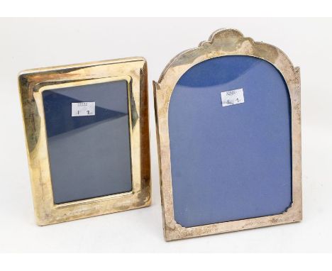 An Arts &amp; Crafts silver frame with shaped domed top, plain sides, easel backed, hallmarked by Saunders &amp; MacKenzie, B