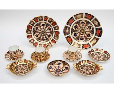 A collection of Royal Crown Derby china 1128 Imari: plates, coffee cans, saucers and pin dishes